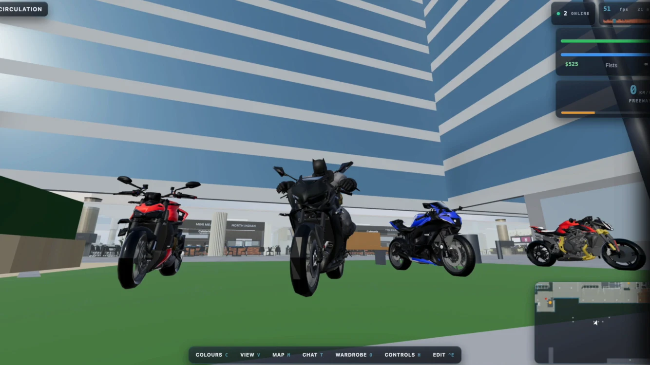 Four superbikes in the bike parking outside the office tower